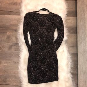 Sparkly body con dress.
